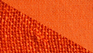 Fabric swatch dyed in orange, demonstrating the vibrant color achieved with our dye on different fabrics